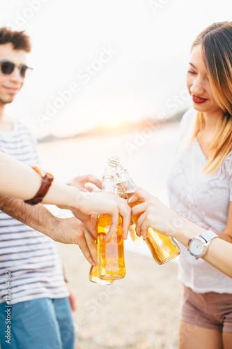 Friends cheering with beer 