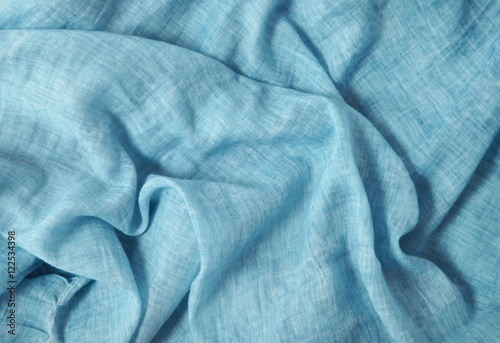 A full page of soft blue linen fabric background texture 
