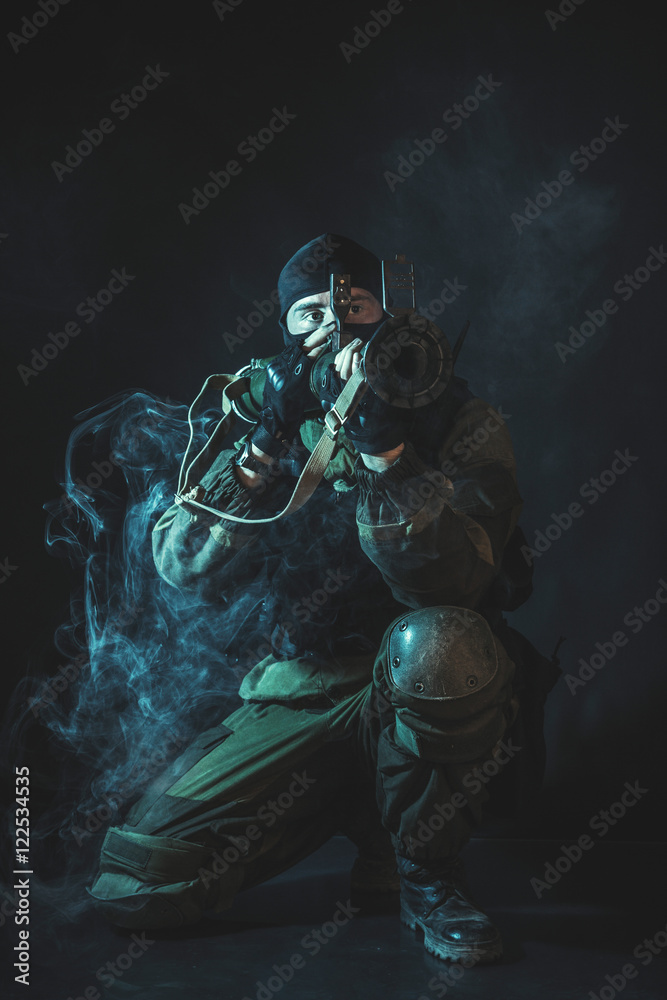 The man in the image of a member of the special forces division with a grenade launcher. Russian police special force - Special Rapid Response Unit or SOBR (Spetsnaz). The man in the image of a member of the special forces division with a grenade launcher. Russian police special force - Special Rapid Response Unit or SOBR (Spetsnaz).