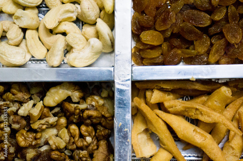 Raisin, cashew, walnuts and snacks in India  photo