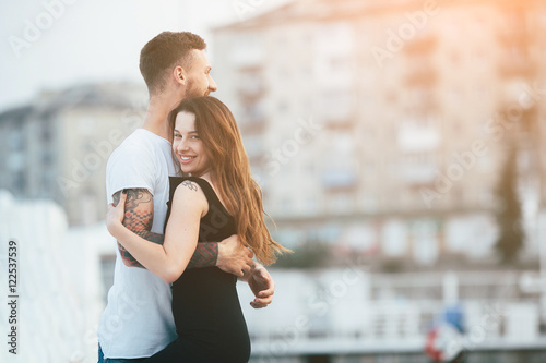 couple posing against the backdrop of the city