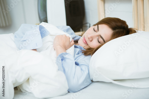 Beautiful asia woman sleeps in the bedroom
