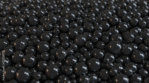 A mass of black balls focused. 3D rendering. Abstract background.