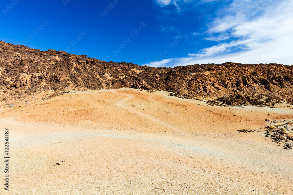 Igneous landscape with mountain range on background, Teide National park, Tenerife, Spain