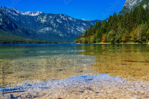 Bohinj lake with Julian Alps reflecting on surface