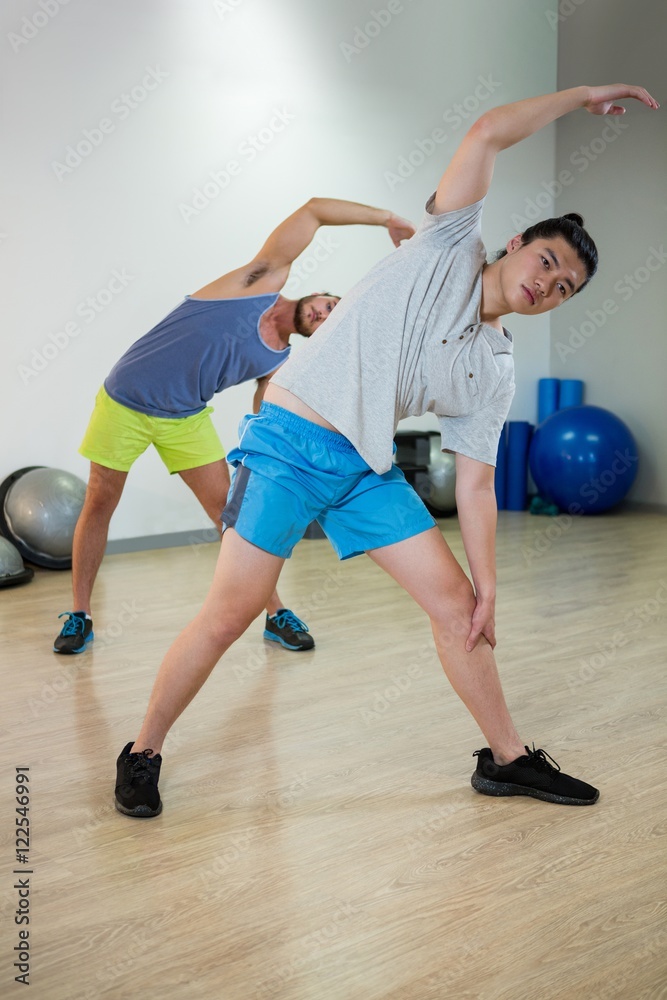 Naklejka premium Two men doing aerobic exercise