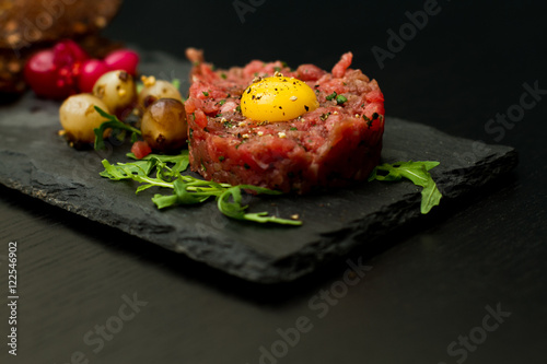 Beef tartar with quail egg and bread