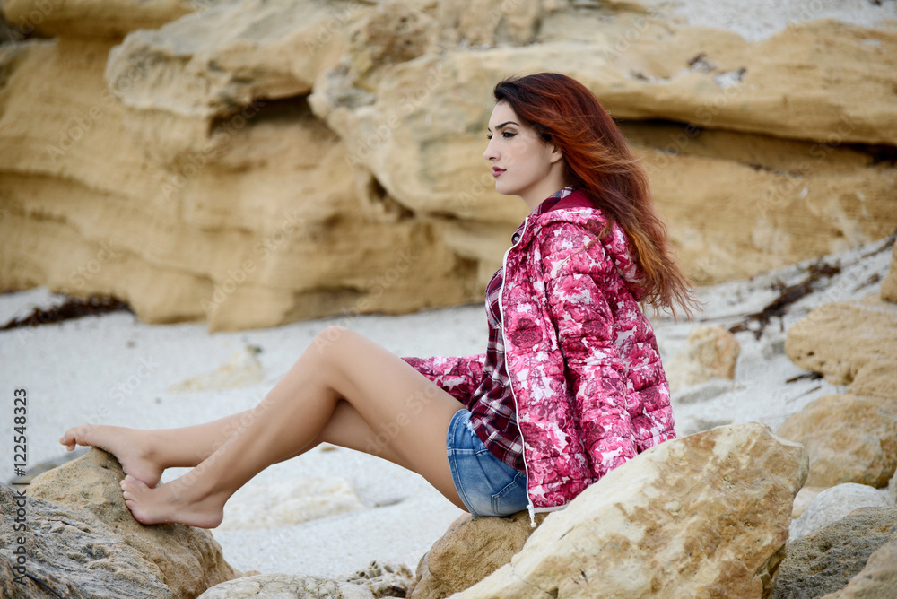 beautiful girl with colorful windbreaker by the sea beautiful girl with colorful windbreaker by the sea