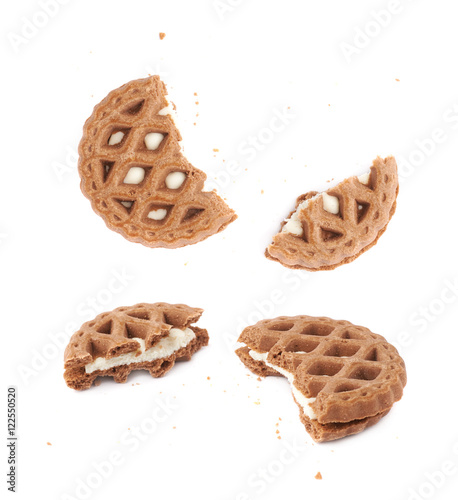Broken into pieces cookie isolated over the white background
