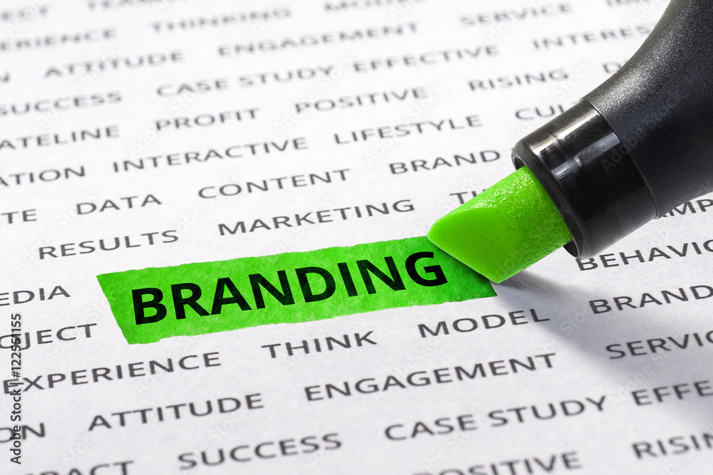 Branding word highlighted with marker on paper of other related business word. Branding word highlighted with marker on paper of other related business word.