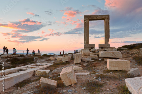 View of Portara and remains of temple of Apollo at sunset.
