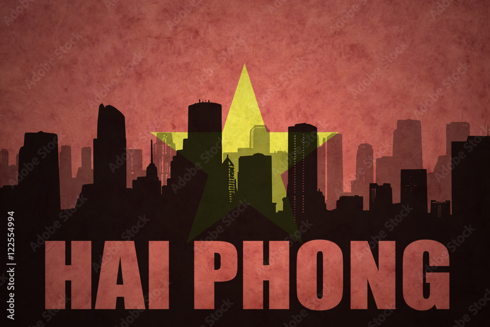 abstract silhouette of the city with text Hai Phong at the vintage vietnamese flag background
