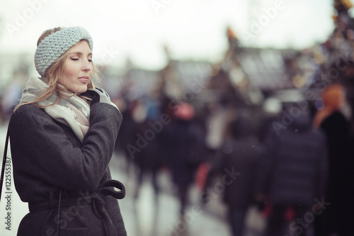 sad pensive woman in winter city street