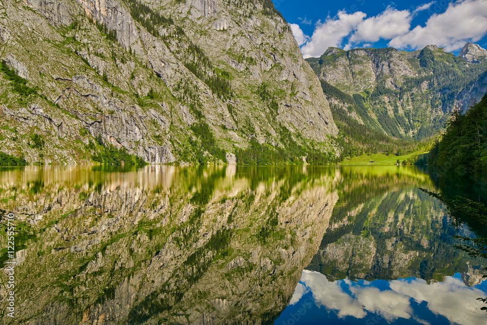 Gorgeous Obersee lake with water mirror in Bavaria, Germany