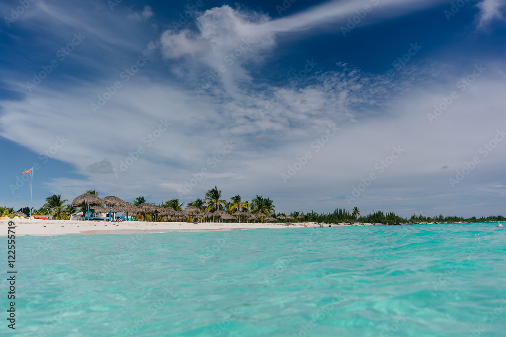 Fototapeta premium The boat in t the Caribbean Sea and the view of the beach of Cayo Largo, Cuba out of the water