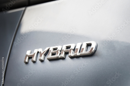 Hybrid inscription on the body of a modern car photo