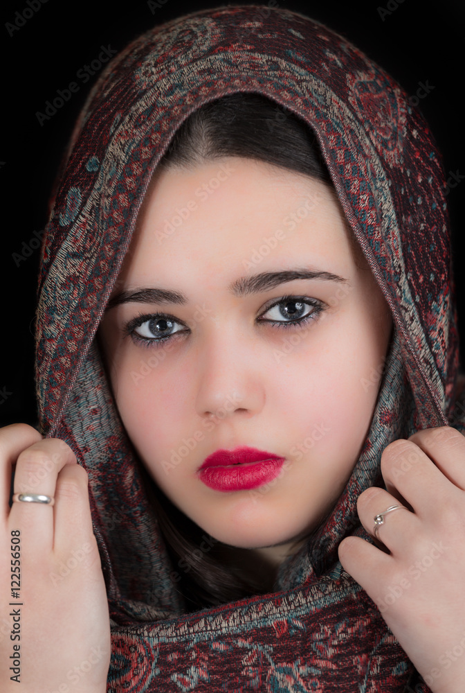 Young woman covered with a headscarf