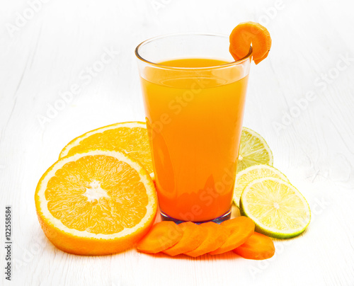 Glasses of ace  juice with carrot,orange and lemon
