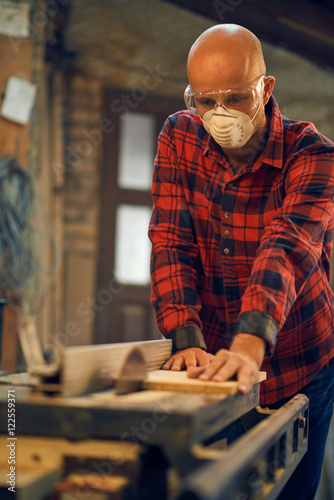 Carpenter at work at his workshop