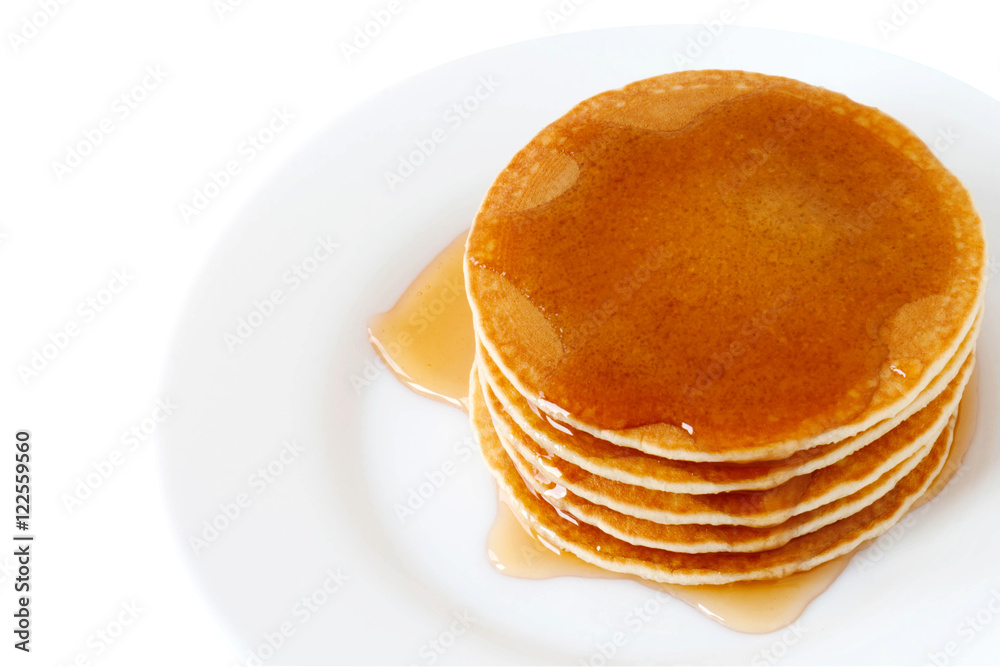 Pancakes with maple syrup isolated on a white background. Breakfast, Dessert. Pancakes with maple syrup isolated on a white background. Breakfast, Dessert.