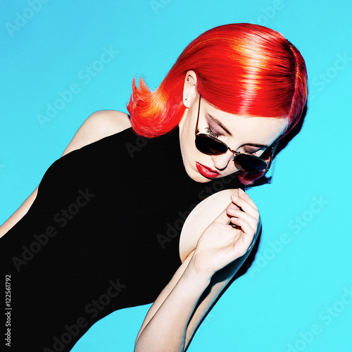 Elegant lady with red hair and stylish sunglasses. retro mood photo