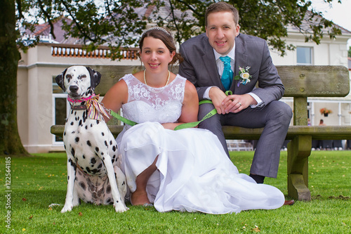 Bride and groom and their dog at their wedding