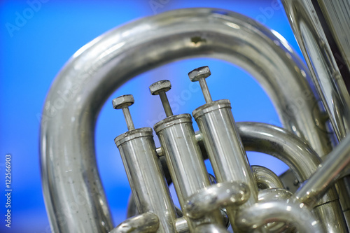 Tuba valves close up against a cool background