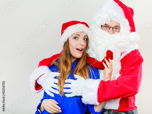 Attractive lady with Santa Claus.