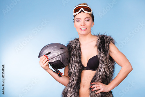 Slim lady is holding helmet. © Voyagerix
