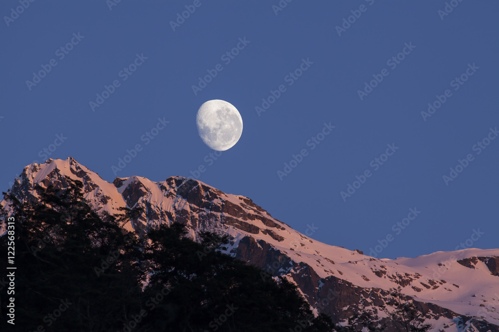 Moon and mountain peak in New Zealand