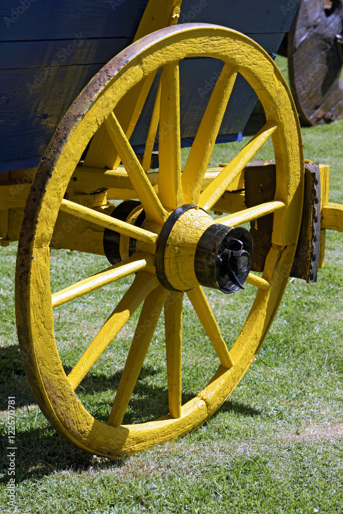 Yellow wheel of ancient wagon