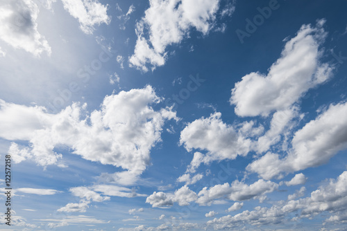 blue sky with white fluffy clouds