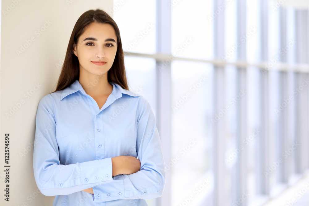 Young brunette businesswoman or student girl looking at camera Young brunette businesswoman or student girl looking at camera