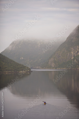 A kayaker heading out into the Grey River, Newfoundland, Canada. photo