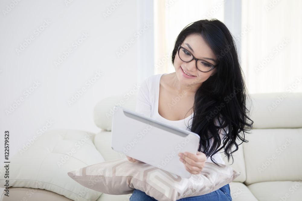 Woman with long hair using tablet Woman with long hair using tablet