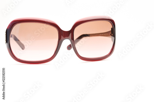 Old sunglass, old style sunglass, red color, on white background, isolated