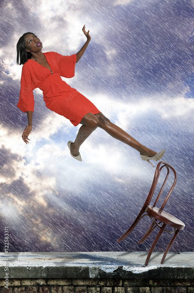 Woman falling off chair