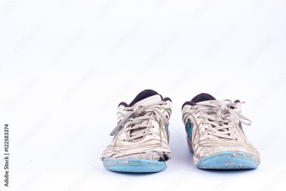 Old worn out futsal sports shoes  on white background  isolated 
