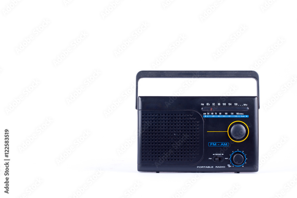 black vintage retro style AM, FM portable radio transistor receiver on white background  isolated 
