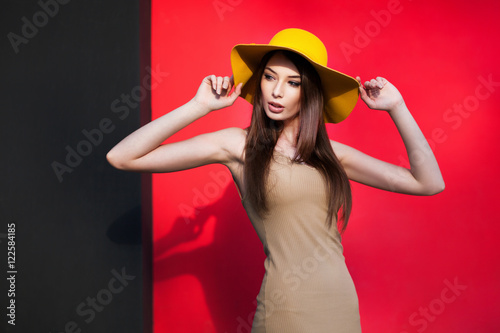 Young girl posing by the color wall