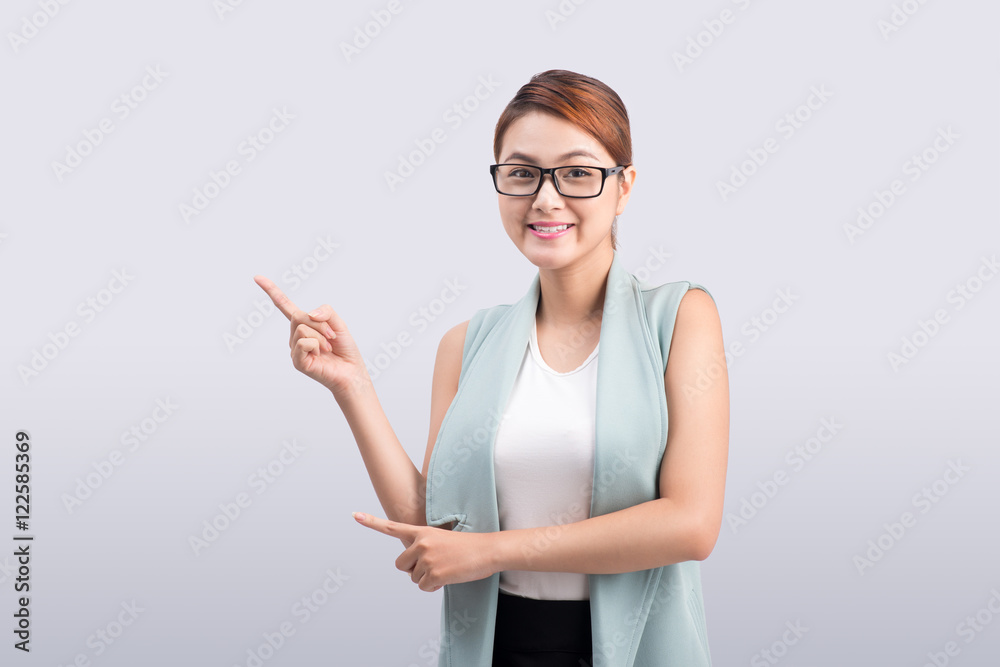young attractive asian businesswoman points to the finger on gre young attractive asian businesswoman points to the finger on gre