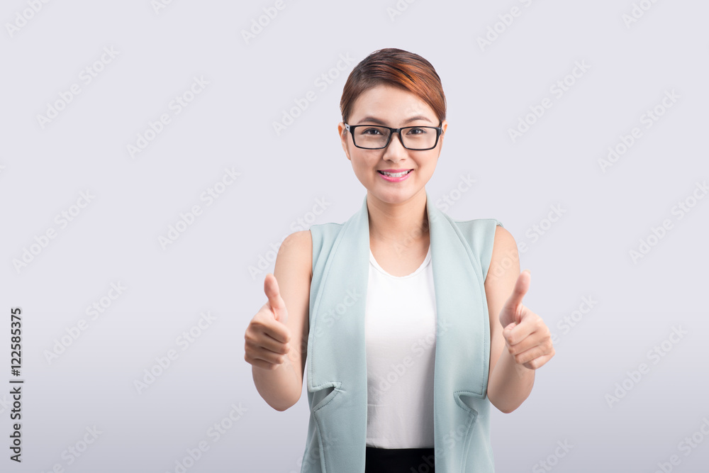 Young pretty Asian Businesswoman showing thumb isolated on white Young pretty Asian Businesswoman showing thumb isolated on white
