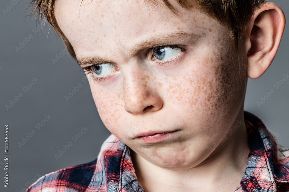 Fototapeta premium face of sad boy with crying blue eyes for anger