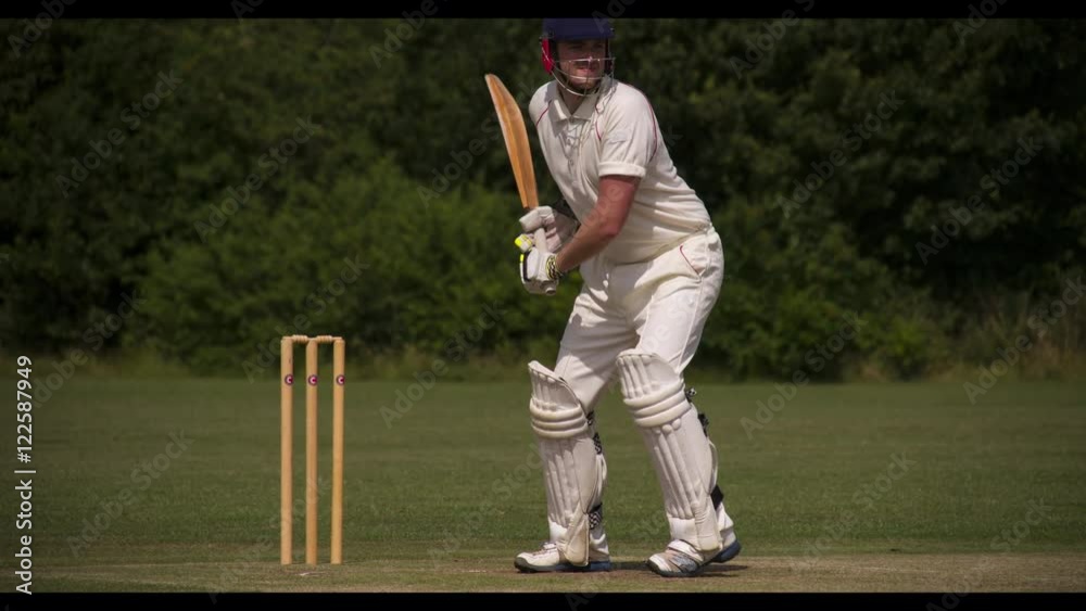 Batman strikes cricket ball cleanly.