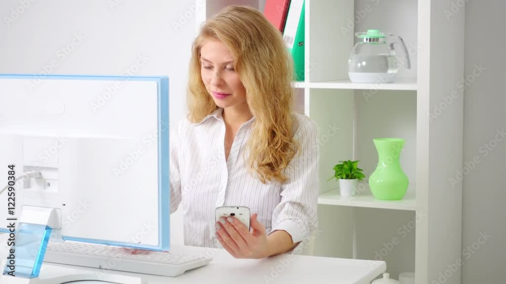 Beautiful young businesswoman working on computer Beautiful young businesswoman working on computer