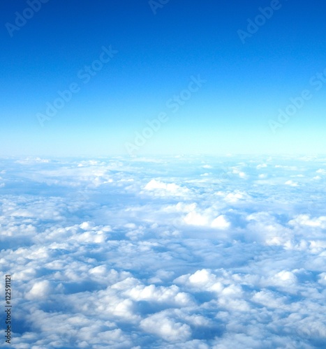 flight above clouds, ultraviolet sky, photo toned