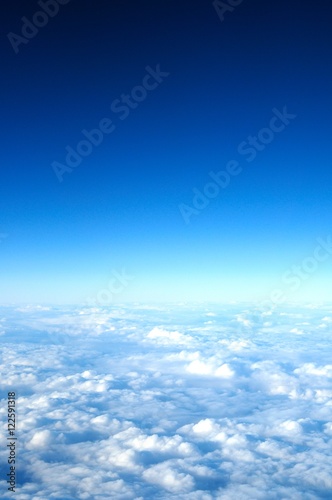 flight above clouds, ultraviolet sky, photo toned