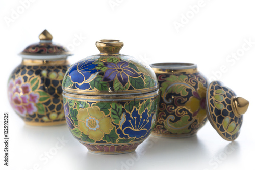 Pot with antique Thai pattern isolated on white background.