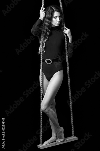 Portrait of beautiful caucasian model posing on black 