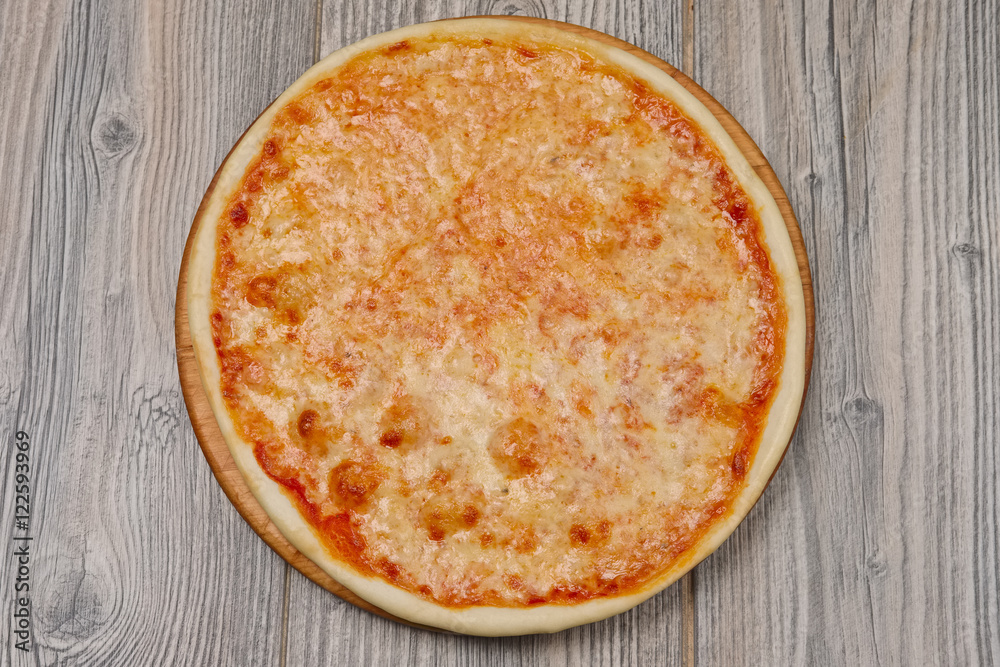 Pizza margherita on wooden table, top view. Pizza margherita on wooden table, top view.